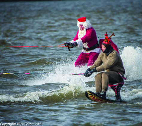 Waterskiing Santa and an elf at the Alexandria waterfront. Photo by Nick Eckert