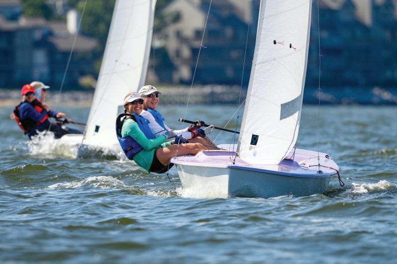 two sailors racing in a sailboat regatta