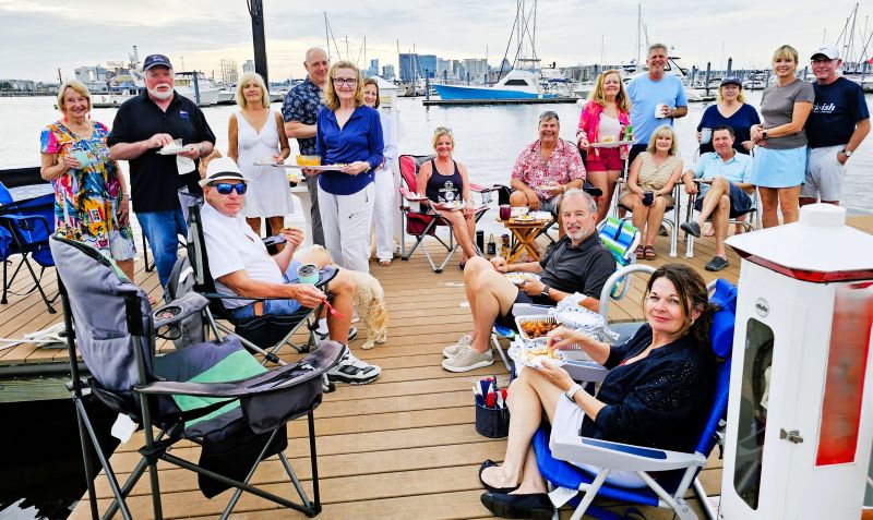 cruising boaters gathered on the dock to socialize