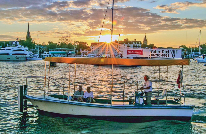 A captain's license is required to drive a commercial vessel. Water taxi in Annapolis Harbor at sunset