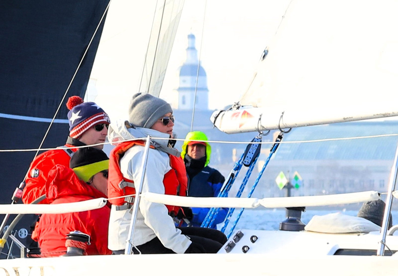 You may already own gear for cold weather sailing. Photo by Will Keyworth three sailors wearing cold weather gear
