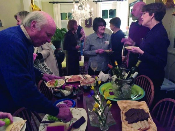 Members enjoying a delicious wine and cheese repast at Steve Bacon’s and Leslie Goodwyn’s house in Annapolis pre-Academy Awards.                                                                                                          