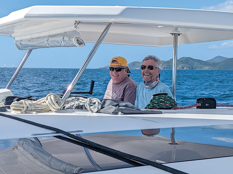 At the helm, BVI sailing charter 2023