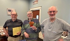 three men smiling