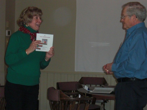 Linda Pasley presenting Bob Stevenson with a history of The Corinthians.