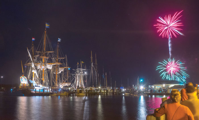 A spectacular fireworks display and illuminated ships impress spectators at Downrigging Weekend. Photo by Eric Moseson