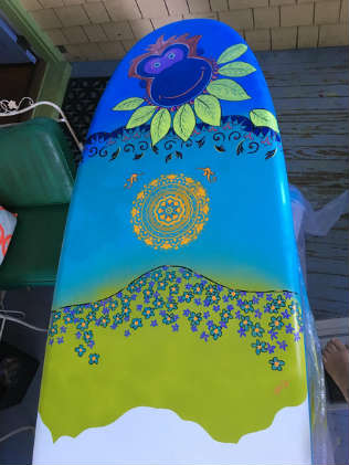 Handpainted paddleboard by local artist Cindy Cole.