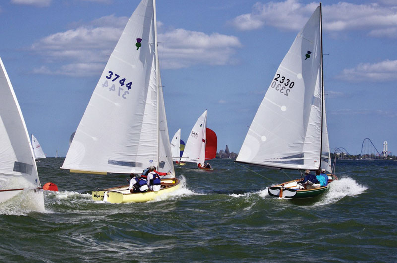 Sailors racing Thistles