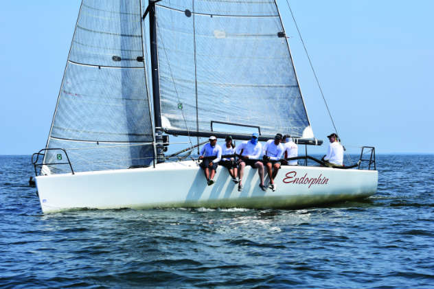 Sail trim tip: ride the inside telltales, having them just on the verge of lifting. Photo by Al Schreitmueller