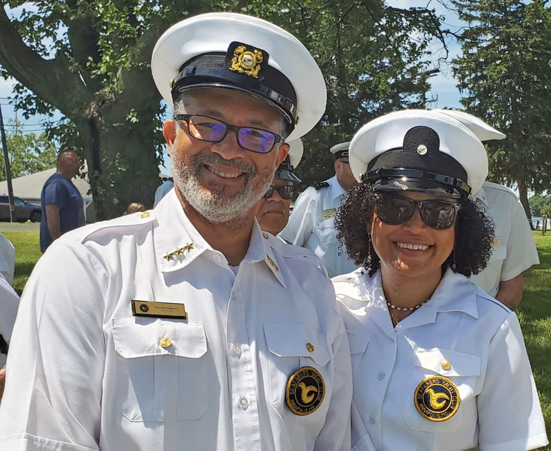 A man and a woman in Sea Scout leader uniforms A man and a woman in Sea Scout leader uniforms