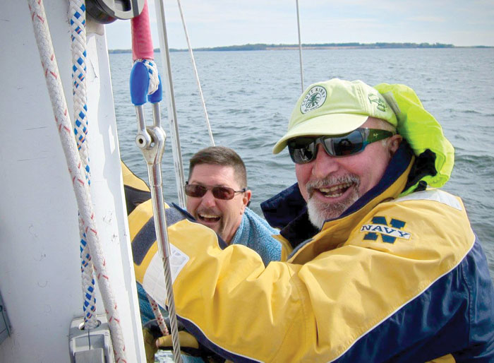 Elliott Peterson (green hat) on the Schooner Heron with fellow SpinSheet Centurion Michael Jewell. Photo by Aram Nersesaian