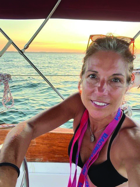 Woman on a sailboat at sunset Woman on a sailboat at sunset