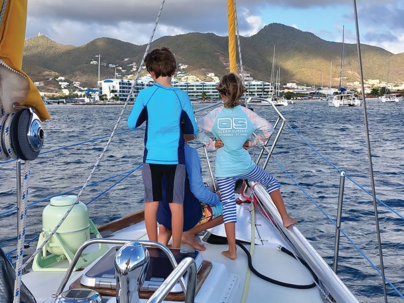 family anchoring a boat