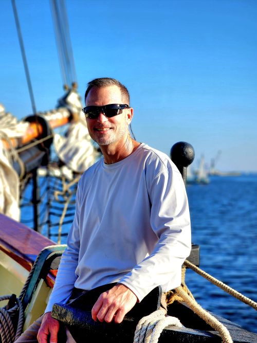 Bill Cox, commodore of Havre de Grace Yacht Club, poses on a large sailboat