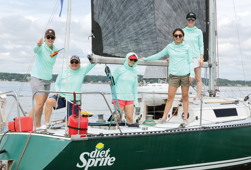 women sailing on a raceboat