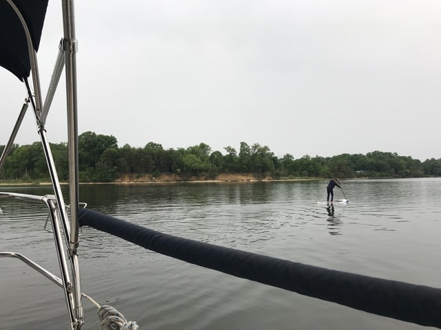 The skipper takes a paddle during which the rain starts in earnest on Tuesday.