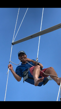 Aidan headed up the mast of his father's sailboat