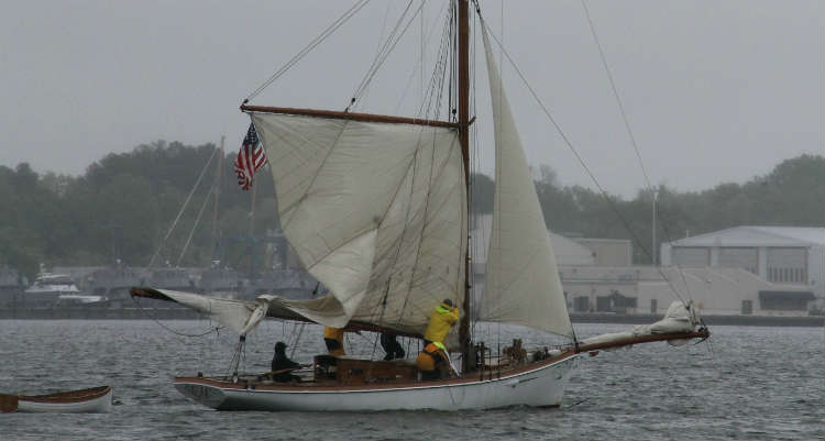 The Elf crew raises sail.