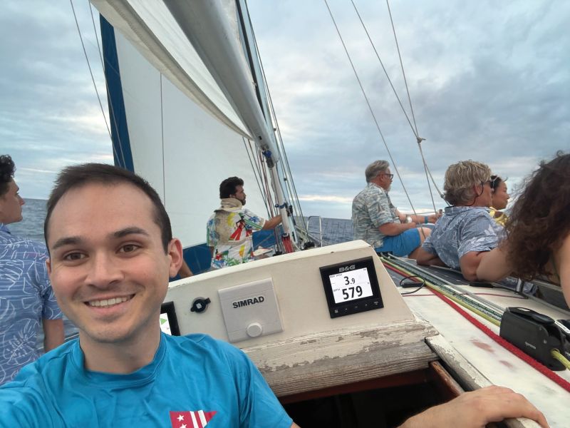 sailors on a boat racing in a regatta