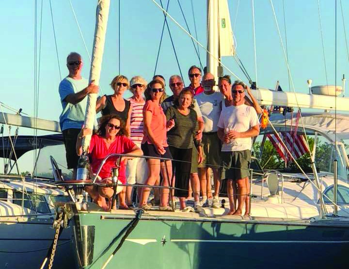 Happy boat owners enjoying socializing on the water.