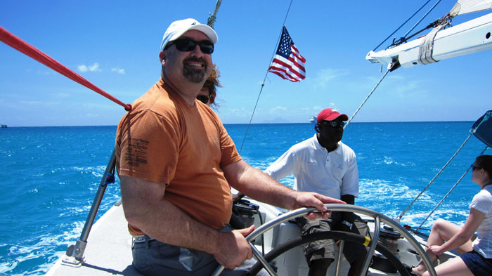 As race committee chair, Keith Jacobs has a passion for providing the best possible sailboat racing experience. Here Jacobs enjoys driving Stars and Stripes.