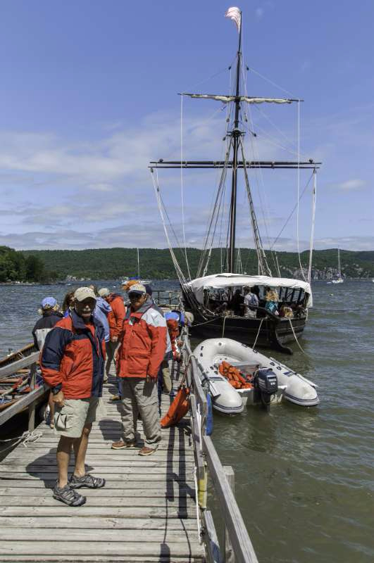 Lake Champlain Maritime Museum. Al Ponessa, left foreground, Mark Smaniotto is on the right.  Behind them are assorted PSC members and a replica of the Philadelphia ll. Photo by Bob Bedell
