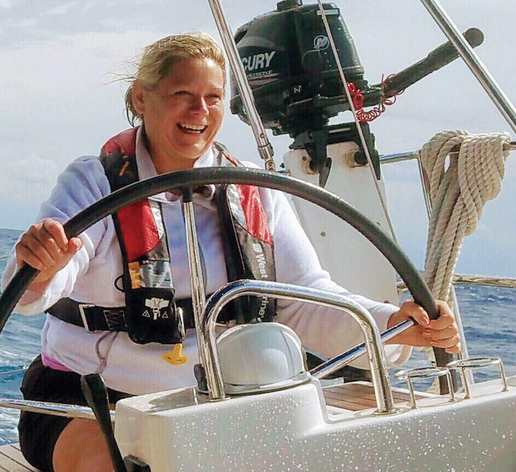 Lora Donia is all smiles at the helm.