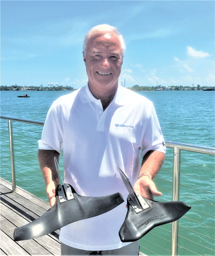 Dale MacDonald holds two Hydro-Shield models