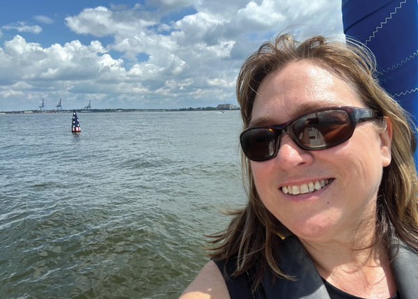 Sailing by the Francis Scott Key Memorial Buoy woman sailing in Baltimore Harbor