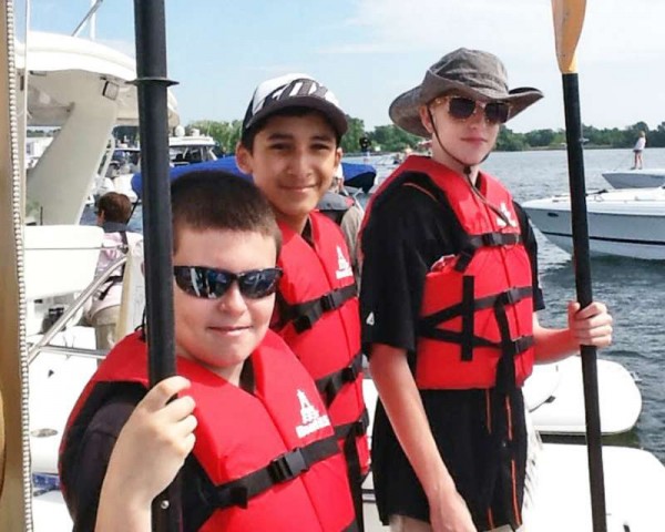 Ben, Rafael Jr., and Joey prepare to row.