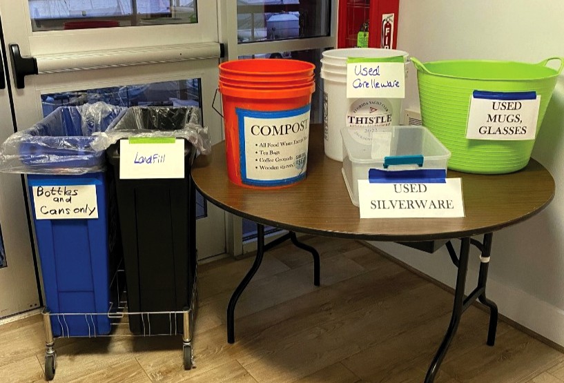 containers labeled for recycling, composting, and the landfill