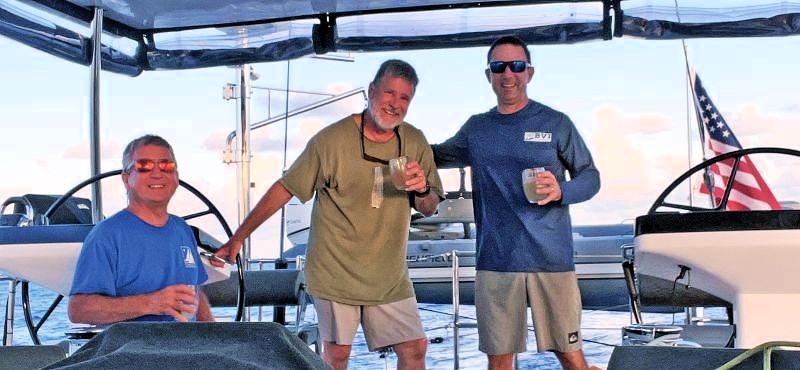 Three men on a sailboat