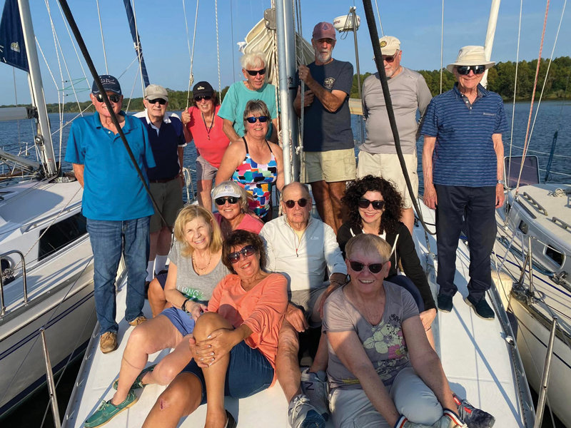 Group of Singles on Sailboats sailors on the deck of a sailboat
