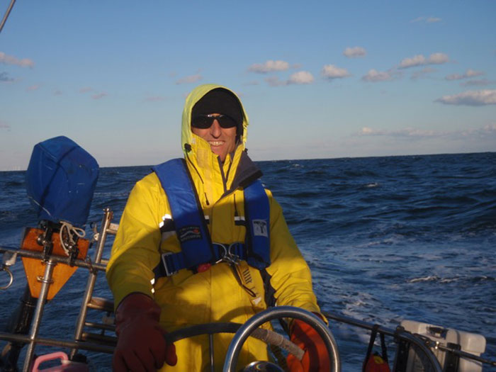 Ted McElhinny at the helm of his parents' Shannon 38 that he bought back after many years.