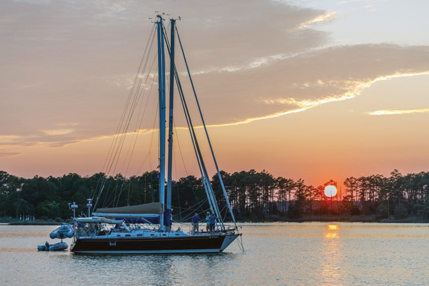 Sailboat anchored at sunset