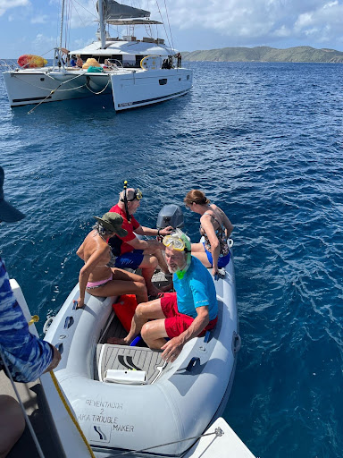 Charter sailboat dinghy on beautiful blue water