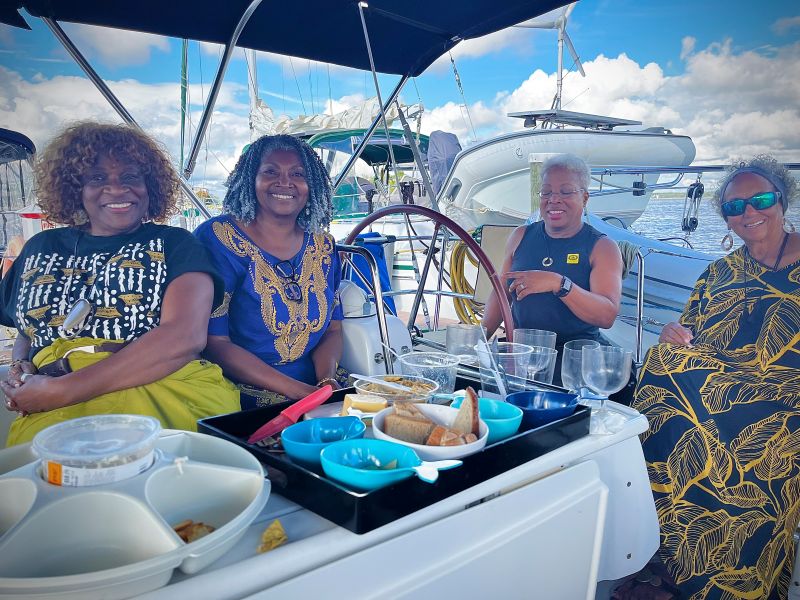 Universal Sailing Club members, camaraderie in cockpit