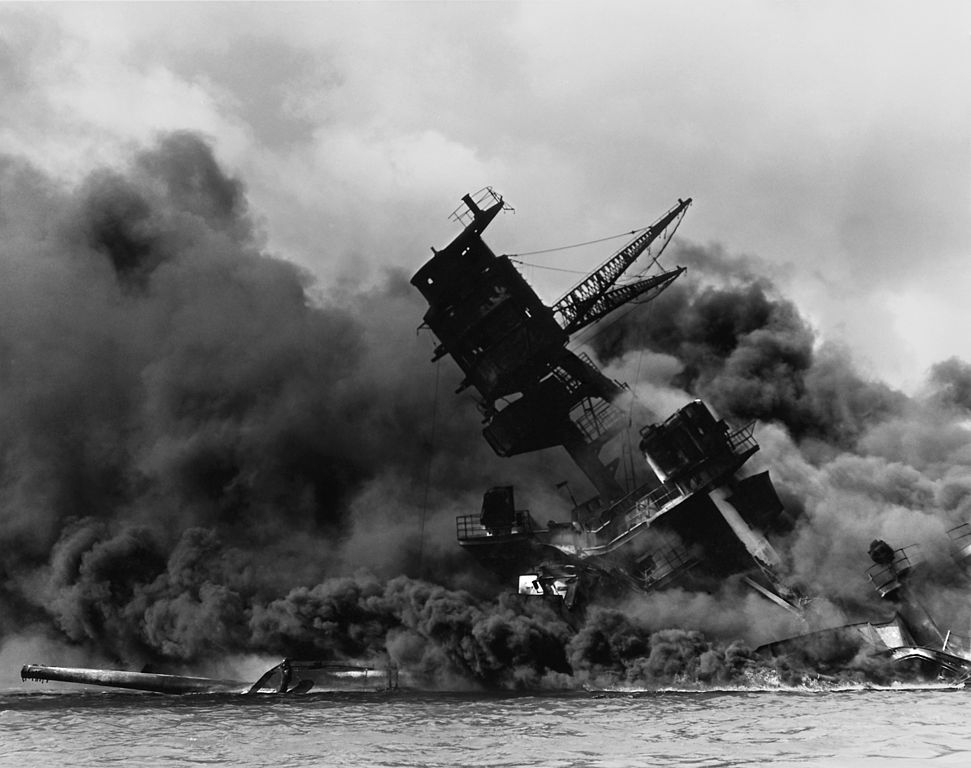 The USS Arizona (BB-39) burning after the Japanese attack on Pearl Harbor, 7 December 1941. USS Arizona sunk at en:Pearl Harbor. The ship is resting on the harbor bottom. The supporting structure of the forward tripod mast has collapsed after the forward 