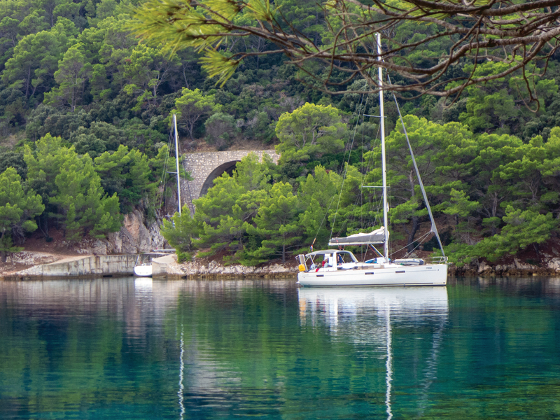 Yacht anchored in front of one of Lastovo's gunboat tunnels
