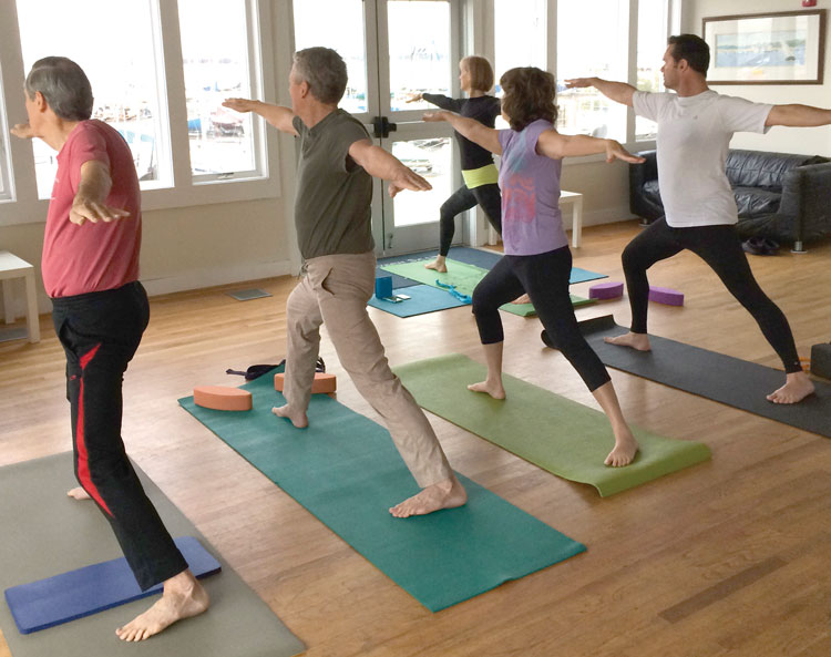 Bonnie Urban teaches yoga on Wednesday mornings at SSA. (L-R) Bill Schneider, Jim Urban, Cheryl Lecourt, Keith Carew, and Urban (front). Photo by P. Sheils