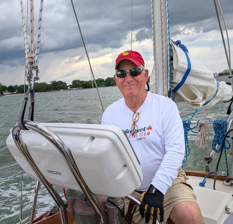 red cap sailing
