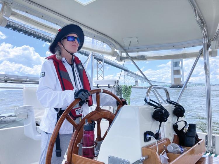 new crew sailing at helm