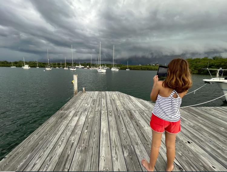 storm clouds sailboats