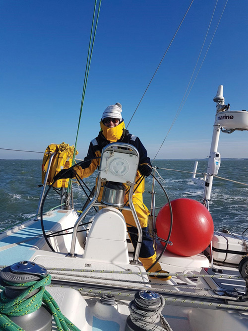 Delivery skipper, Charlotte, at the helm.