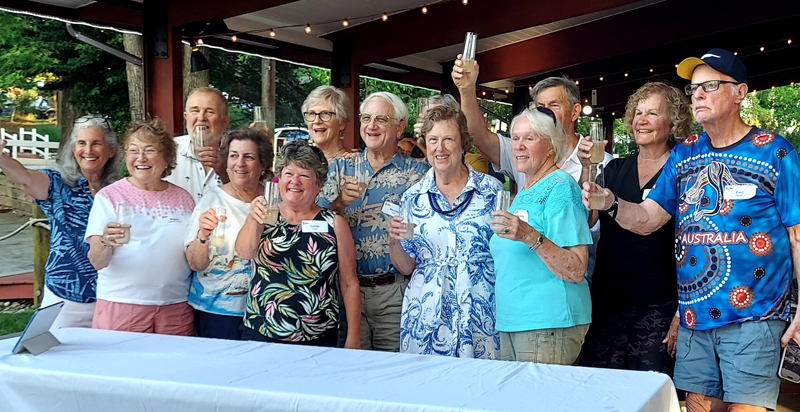 SOS members toast the anniversary of their cruising club. Club members toast the anniversary of their cruising club