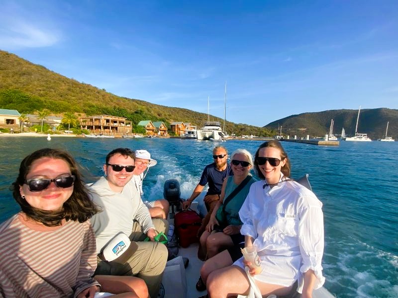 charter captain operating a dinghy with guests