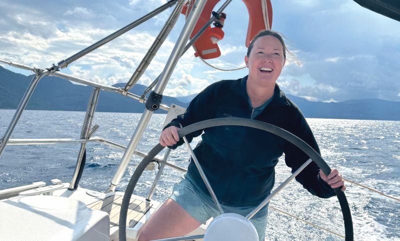 a woman sailing a boat