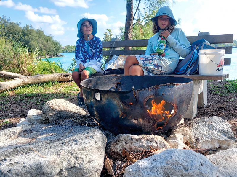 Newton and Silas around the campfire at Higg' Island, Bermuda Campfire at Higg' Island, Bermuda