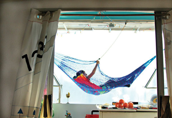 Life in the cockpit of a 44-foot shrink-wrapped catamaran. Photo by Cindy Wallach