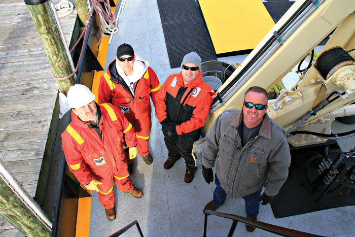 The Widener crew: chief engineer Doug Otten; Robert Heim, mate; Michael Marozza, crewmember; and captain Jeff Lill.